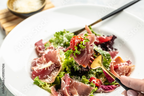 Salad with Prosciutto, ham and grapefruit jamon, salad mix, grapefruit, cherry tomatoes, parmesan cheese. Healthy food, keto diet, diet lunch concept