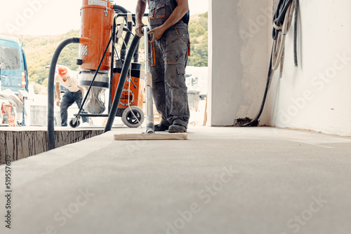 A closeup shot of a worker preparing floor for painting