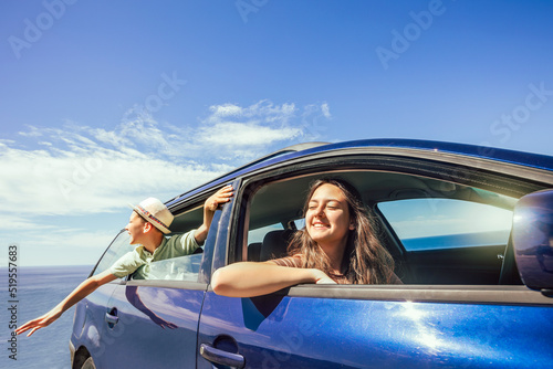 Boy and girl in off road car, family vacation concept