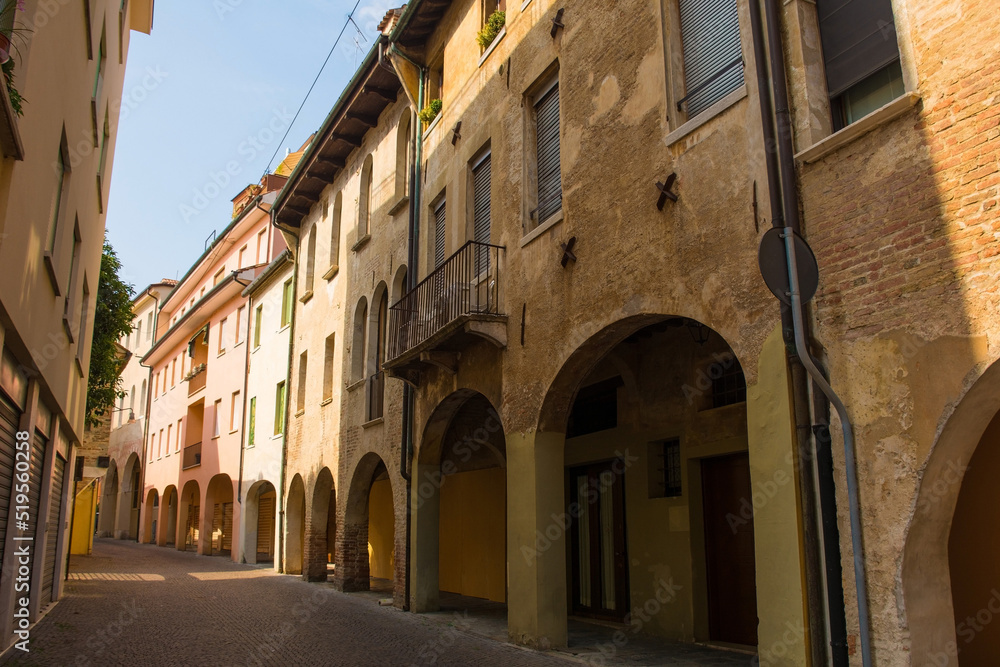 A quiet residential street with an arched portico in the historic centre of Treviso in Veneto, north east Italy
