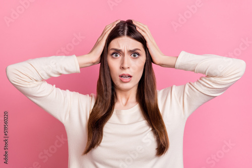Portrait of attractive worried puzzled girl wow sudden news reaction isolated over pink pastel color background