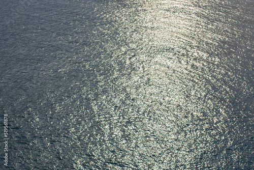 Top view of blue frothy sea surface. Shot in the open sea from above.