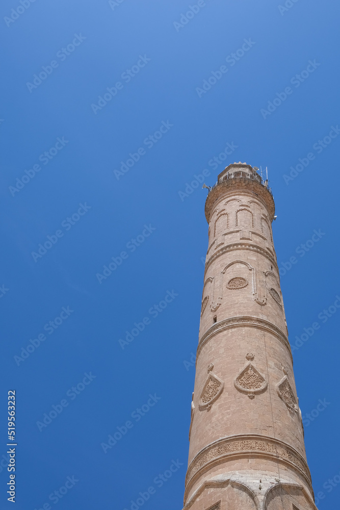 Mosque minaret with blue sky. Minaret of Ulu Mosque. 