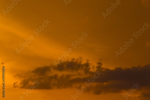 Sunset sky orange yellow color clouds background nature in the evening © Andrey