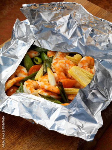Prawns and vegetables steamed in foil photo