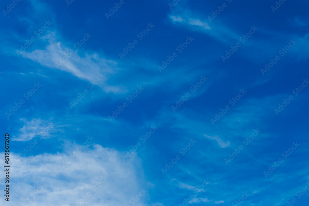 Bright blue sky in the evening with white soft clouds natural background weather air Bright blue sky in the evening with white soft clouds natural background weather air