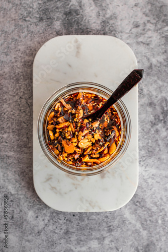 Homemade Chili Crisp - oil-based Chinese condiment made of pepper flakes, fried garlic, and fermented soybeans