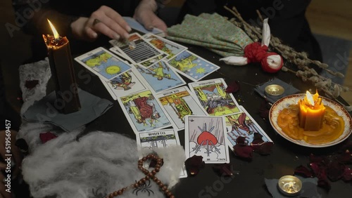 Wallpaper Mural 4K. A witch woman in a dark room reading tarot cards Torontodigital.ca