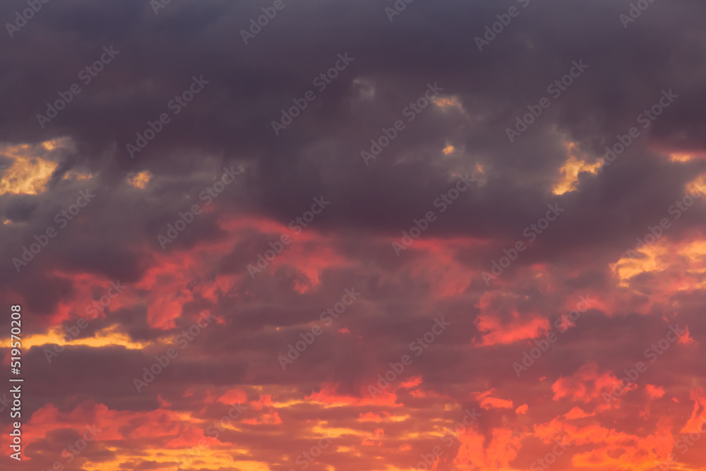 Bright red-orange sunset sky clouds summer background nature evening