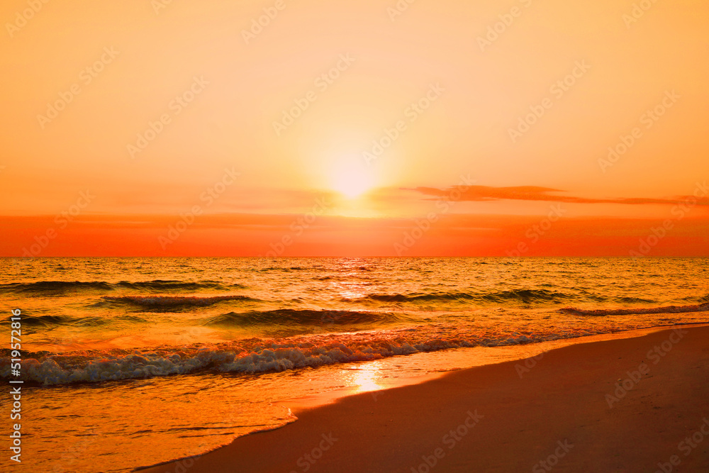 Beautiful view of orange sky over sea at sunset Beautiful view of orange sky over sea at sunset