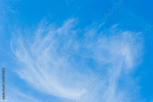 White cirrus clouds weather change wind natural background against the blue sky