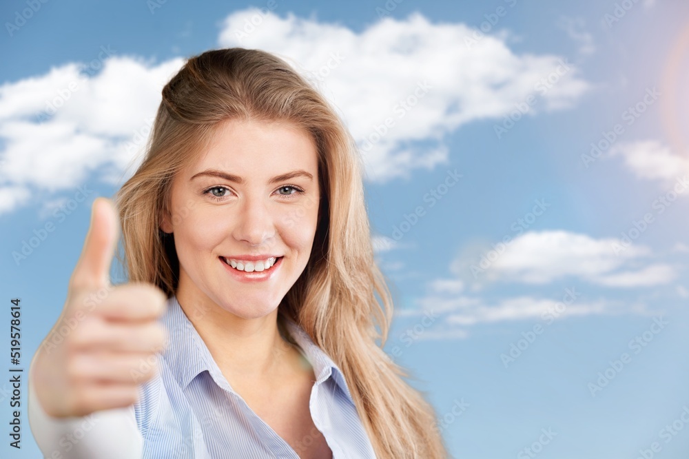Young smiling fun happy woman showing thumb up like gesture. People lifestyle concept Young smiling fun happy woman showing thumb up like gesture. People lifestyle concept