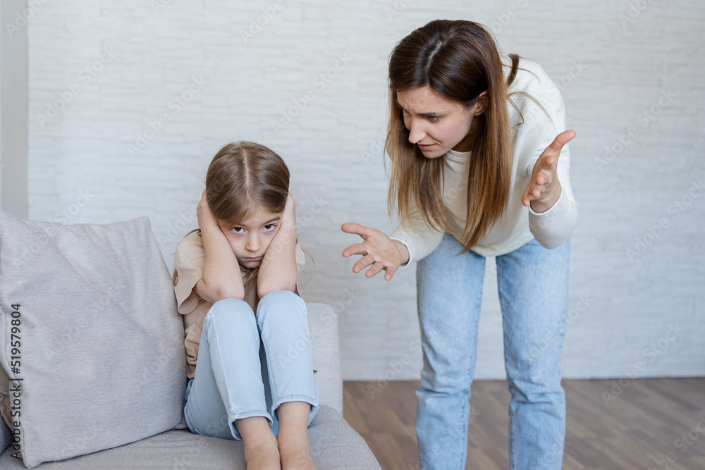 Quarrel between mother and daughter at home. The education of the child. mother scolds her child girl. family relationships. Quarrel between mother and daughter at home. The education of the child. mother scolds her child girl. family relationships.