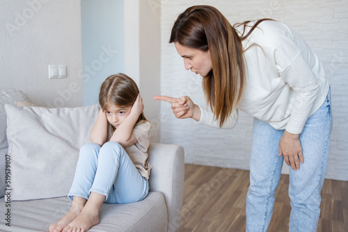 Quarrel between mother and daughter at home. The education of the child. mother scolds her child girl. family relationships.