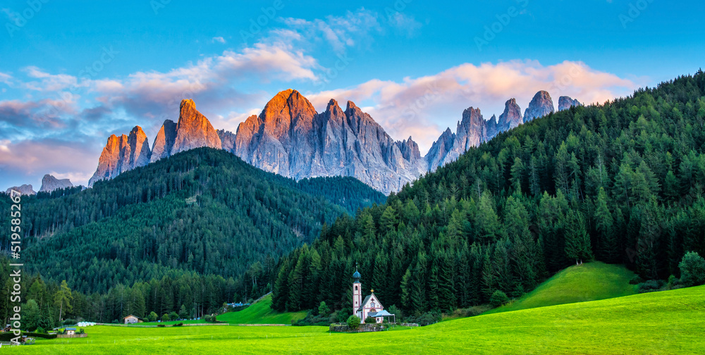 Wonderful landscape of Dolomite Alps during sunset. St Johann Church, Santa Maddalena, Val Di Funes, Dolomites, Italy. Amazing nature background. Artistic picture. Beauty world.