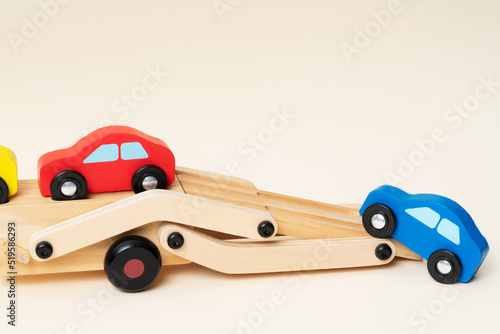 Close up view of toy tow truck towing damaged cars after a serious accident. © Grzegorz