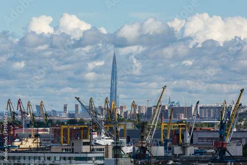 Russia. Saint-Petersburg. Commercial port on the background of the Lakhta Center tower. photo