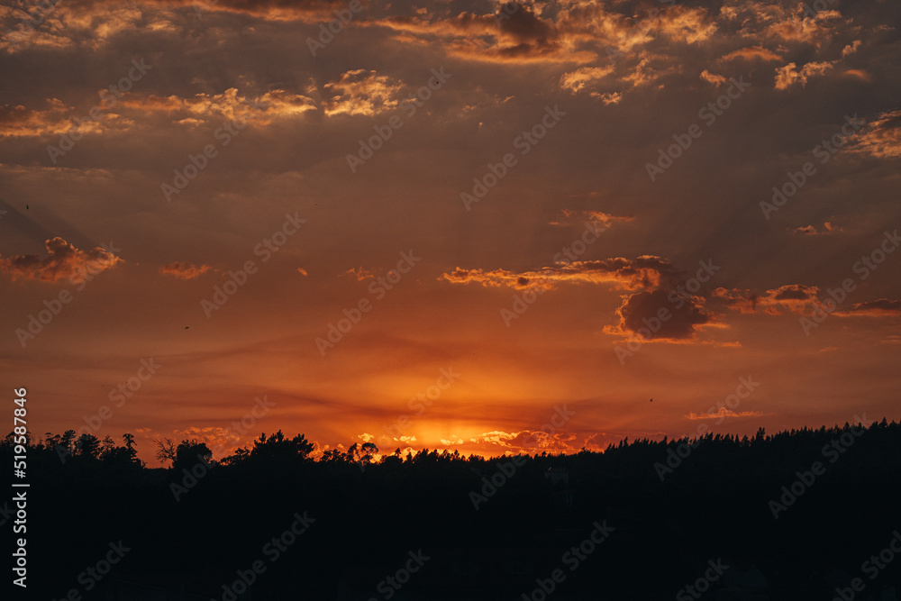 Fototapeta premium Beautiful Orange Purple Sunset over Mountains 