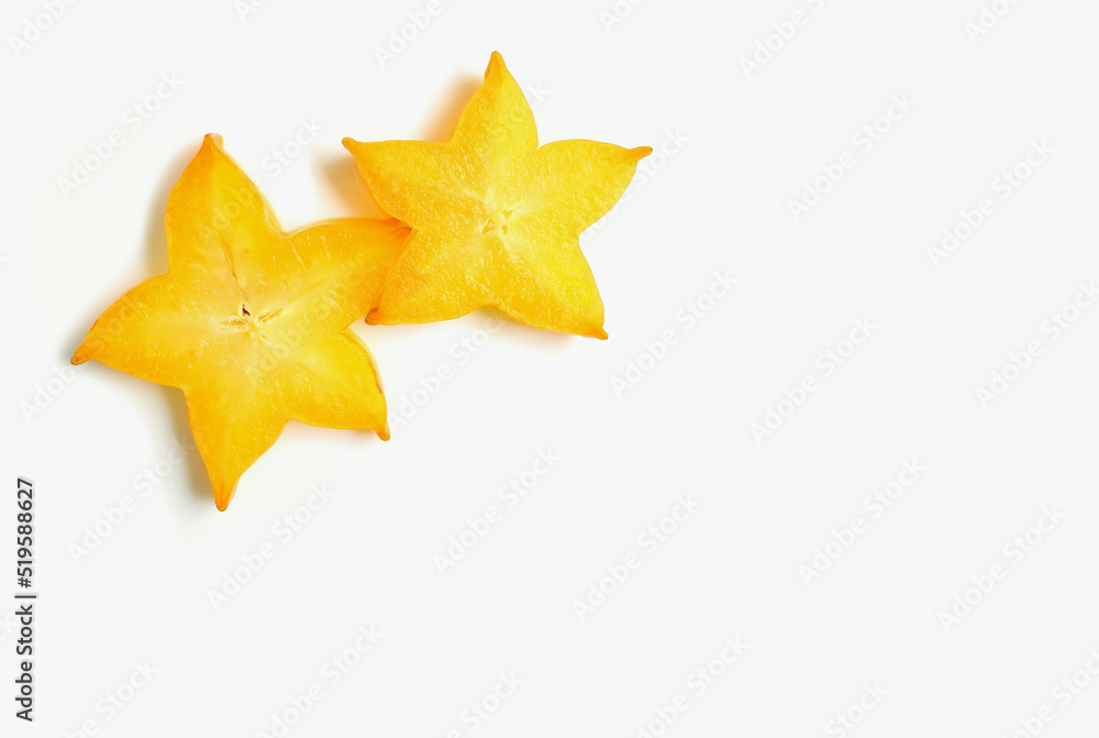 A Pair of Juicy Fresh Ripe Starfruit Slices on White Background A Pair of Juicy Fresh Ripe Starfruit Slices on White Background