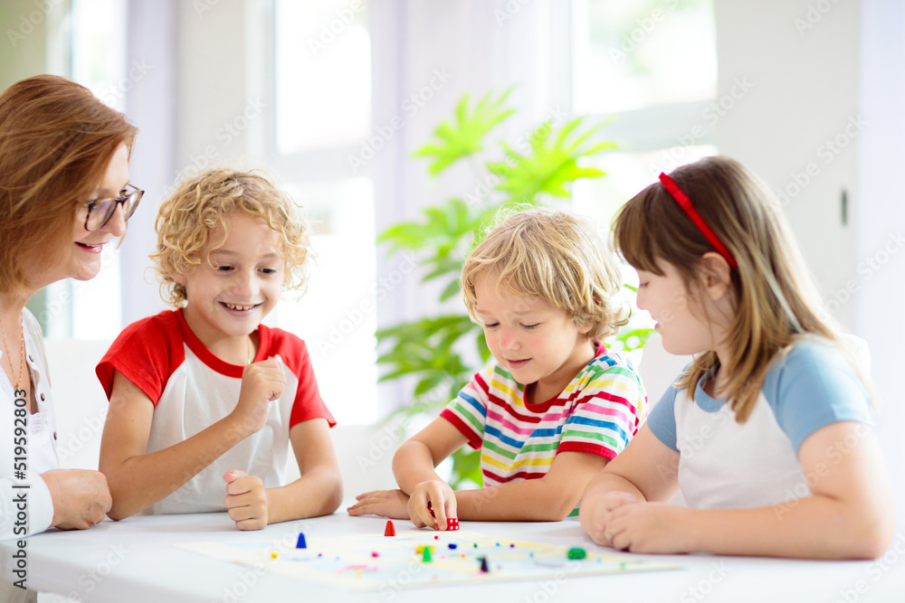 Family playing board game. Kids play. Family playing board game. Kids play.
