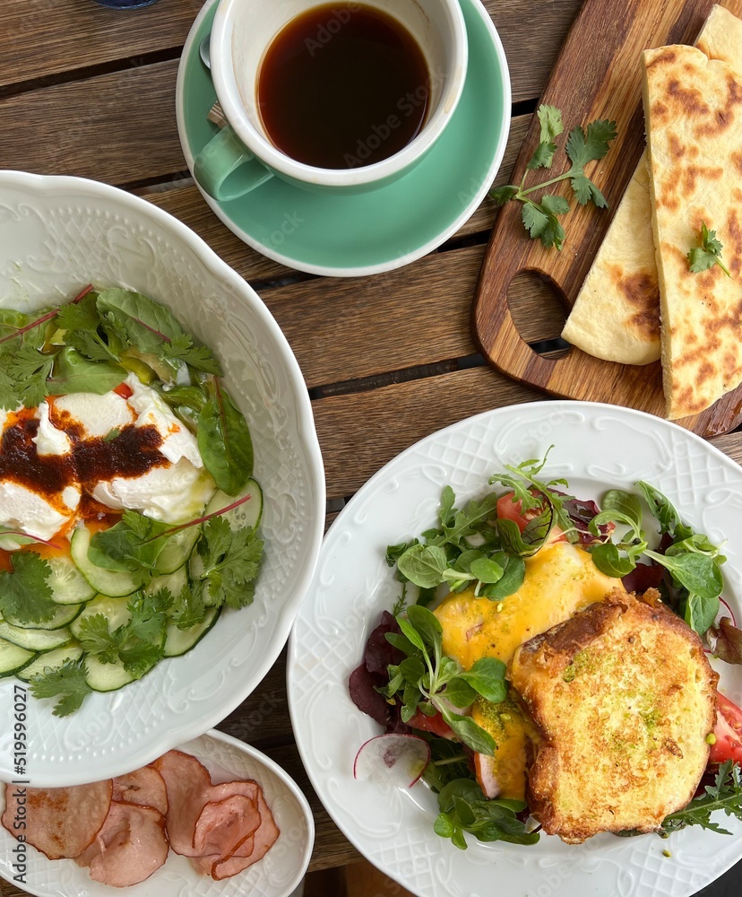 breakfast in cafe with coffee on wooden table top view breakfast in cafe with coffee on wooden table top view