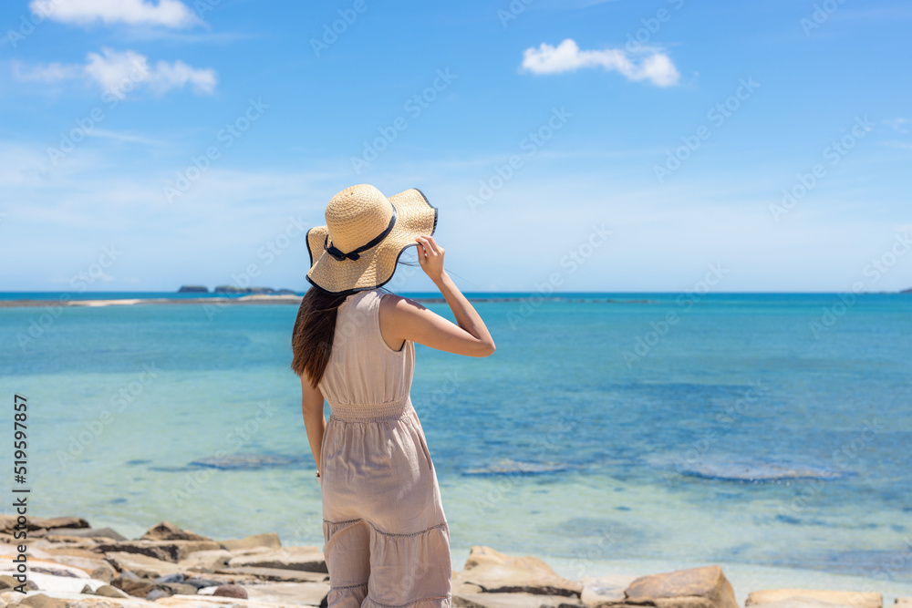 Woman look at the sea in summer vacation