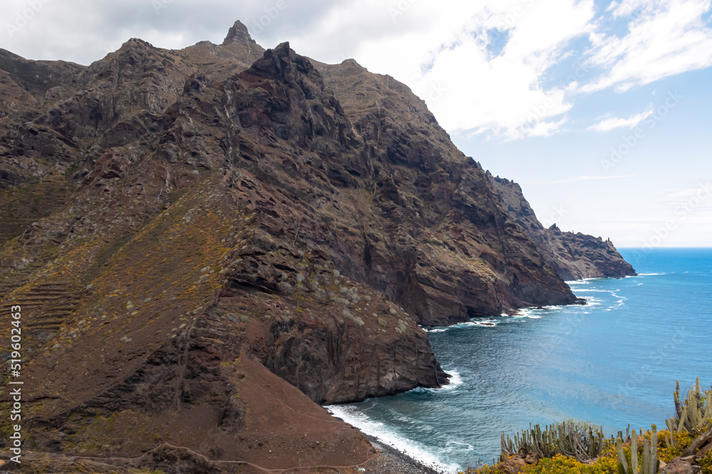 Panoramic view of Atlantic Ocean coastline and Anaga mountain range on Tenerife, Canary Islands, Spain, Europe, EU. Path to beach Playa del Tamadite. Scenic coastal hiking trail from Afur to Taganana