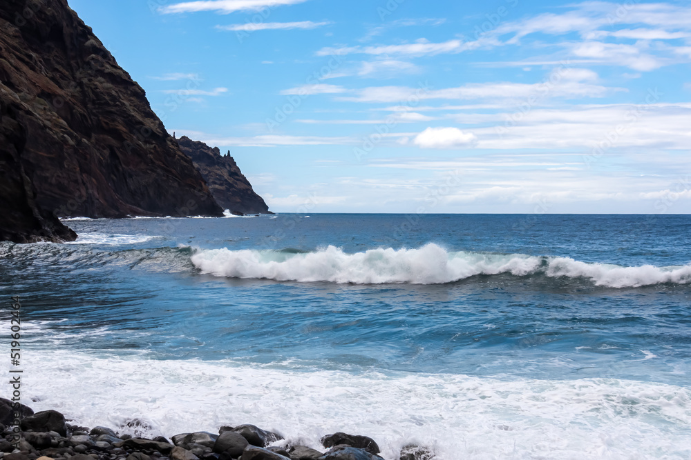 Scenic view on pebble beach Playa del Tamadite in Anaga mountains, Tenerife, Canary Islands, Spain, Europe. Panoramic coastal hiking trail from Afur to Taganana. Waves from Atlantic Ocean. Seascape Scenic view on pebble beach Playa del Tamadite in Anaga mountains, Tenerife, Canary Islands, Spain, Europe. Panoramic coastal hiking trail from Afur to Taganana. Waves from Atlantic Ocean. Seascape