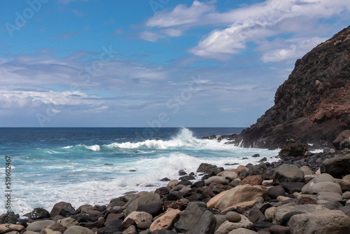 Scenic view on pebble beach Playa del Tamadite in Anaga mountains, Tenerife, Canary Islands, Spain, Europe. Panoramic coastal hiking trail from Afur to Taganana. Waves from Atlantic Ocean. Seascape photo
