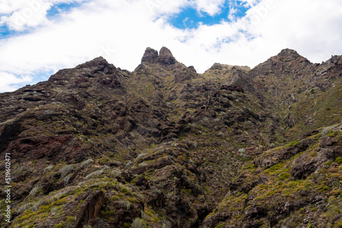 Panoramic view on El Dedo del Roque Pai crag, Roque Paez in the Anaga mountain range, Tenerife, Canary Islands, Spain, Europe. Scenic hiking trail from Afur to Taganana through canyon Barranco de Afur photo