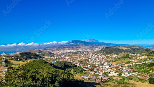 Panoramic view from the viewing platform Mirador de Jardina on a mountain village near San Cristobal de La Laguna, northeastern Tenerife, Canary Islands, Spain, Europe, EU. Volcano Teide in the back photo