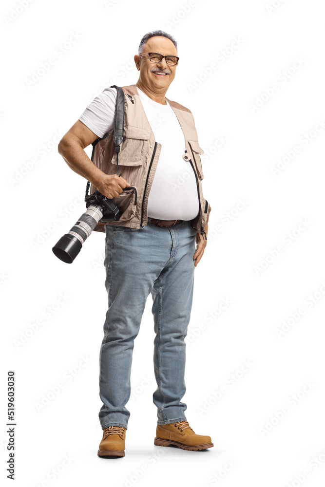 Full length portrait of a mature male photographer carrying a professional camera and smiling Full length portrait of a mature male photographer carrying a professional camera and smiling