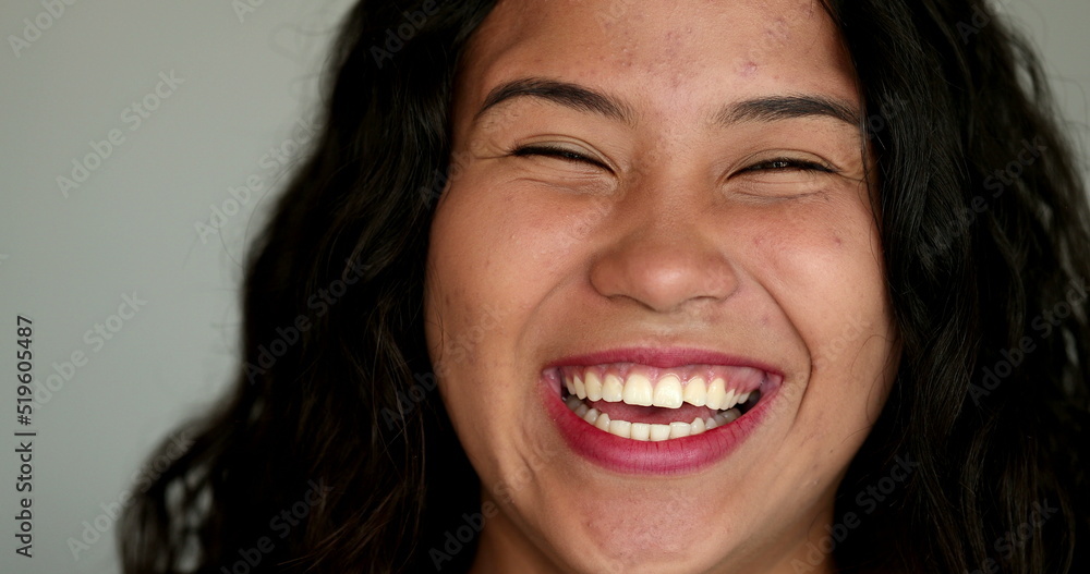 Casual hispanic girl laughing and smiling. Latina young woman real life laugh and smile Casual hispanic girl laughing and smiling. Latina young woman real life laugh and smile