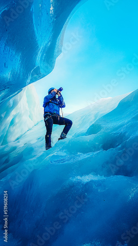 Photographer in a glacier