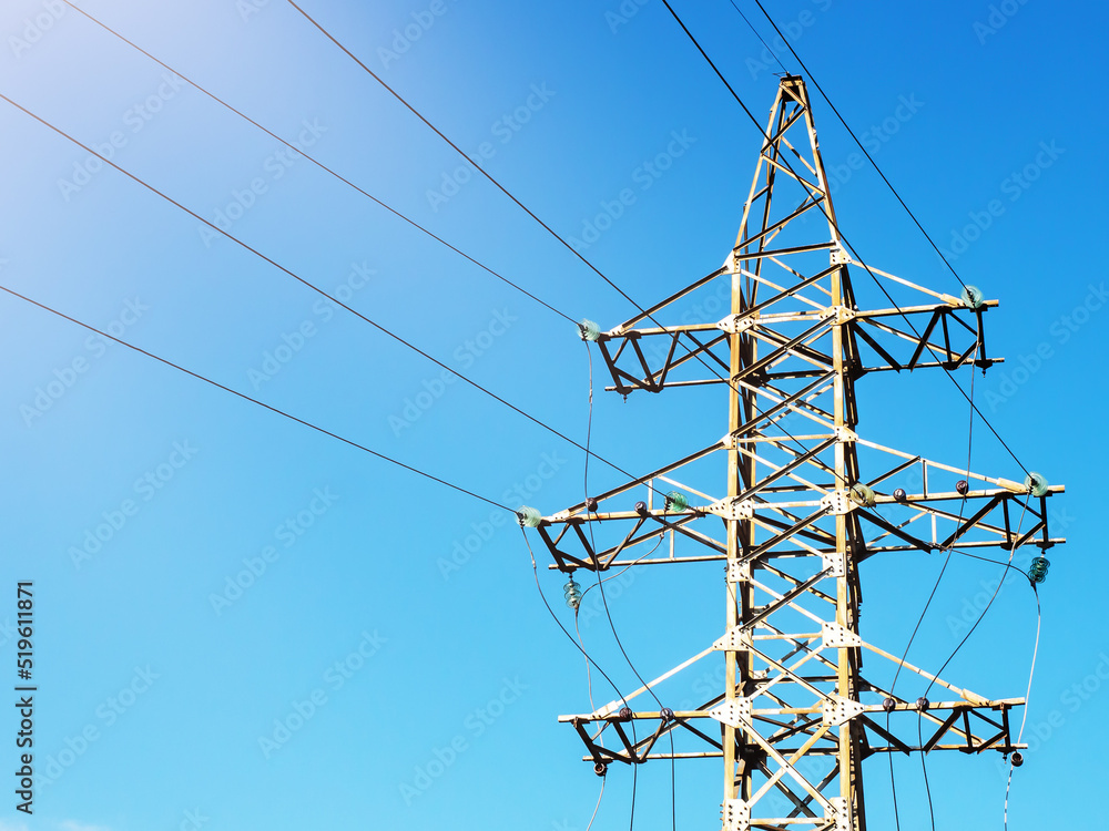 Electric pole with wires against the blue sky Electric pole with wires against the blue sky