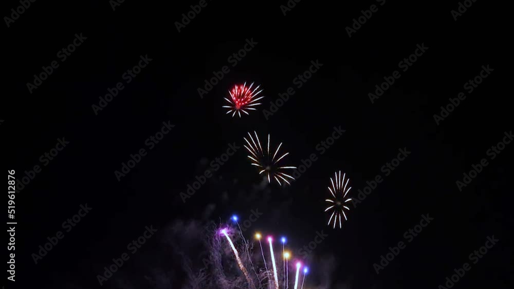 4K. loop seamless of real fireworks background. abstract blur of real golden shining fireworks with bokeh lights in the night sky. glowing fireworks show. New year's eve fireworks celebration. 4K. loop seamless of real fireworks background. abstract blur of real golden shining fireworks with bokeh lights in the night sky. glowing fireworks show. New year's eve fireworks celebration.