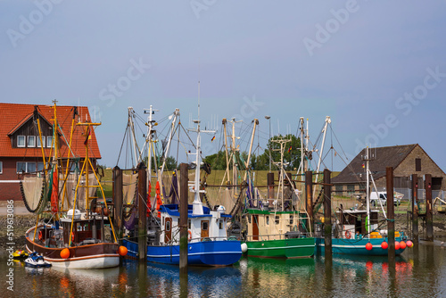 View of the shrimp cutter in the port of Fedderwardersiel/Germany on the North Sea © fotografci