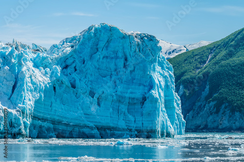 A view the snout of the Hubbard Glacier protruding into Russell Fjord in Alaska in summertime