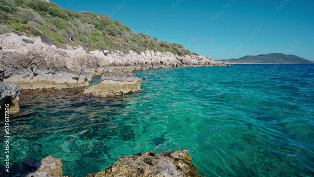 panoramic view of clear turcuoise water of mediterranean sea at rocky coast in Marmaris, Turkey. Summertime, tourist season, beautiful coastline of turkish resorts panoramic view of clear turcuoise water of mediterranean sea at rocky coast in Marmaris, Turkey. Summertime, tourist season, beautiful coastline of turkish resorts