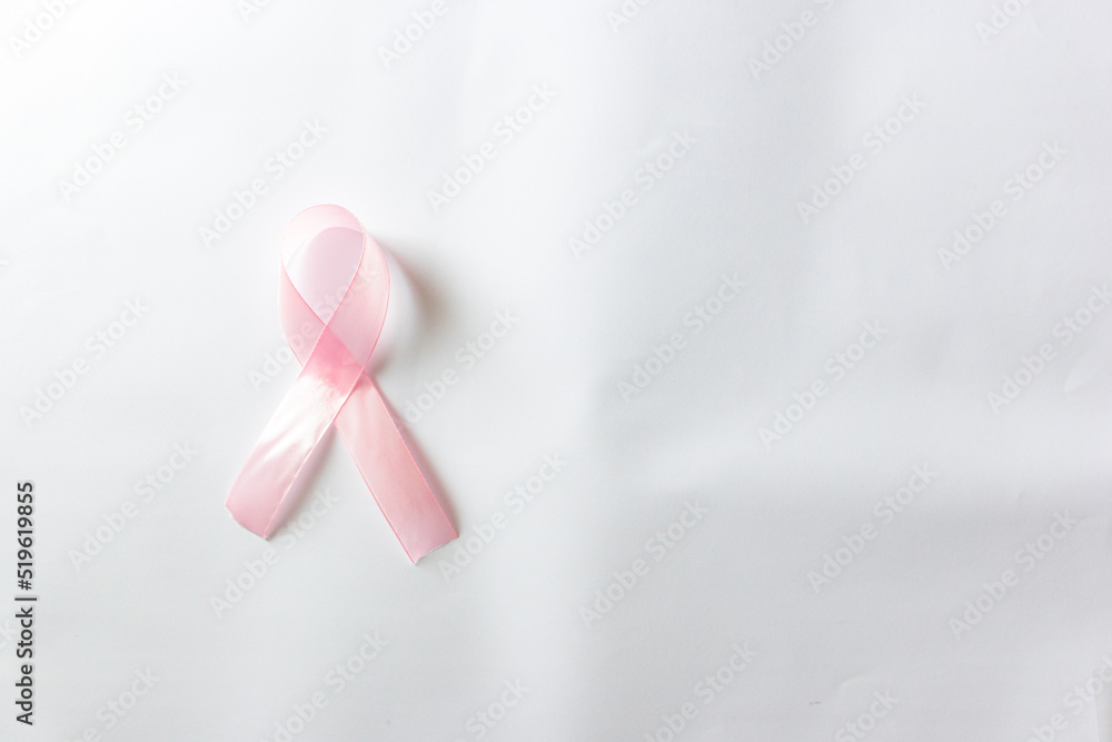 Pink ribbon on white background, top view. Cancer awareness Pink ribbon on white background, top view. Cancer awareness