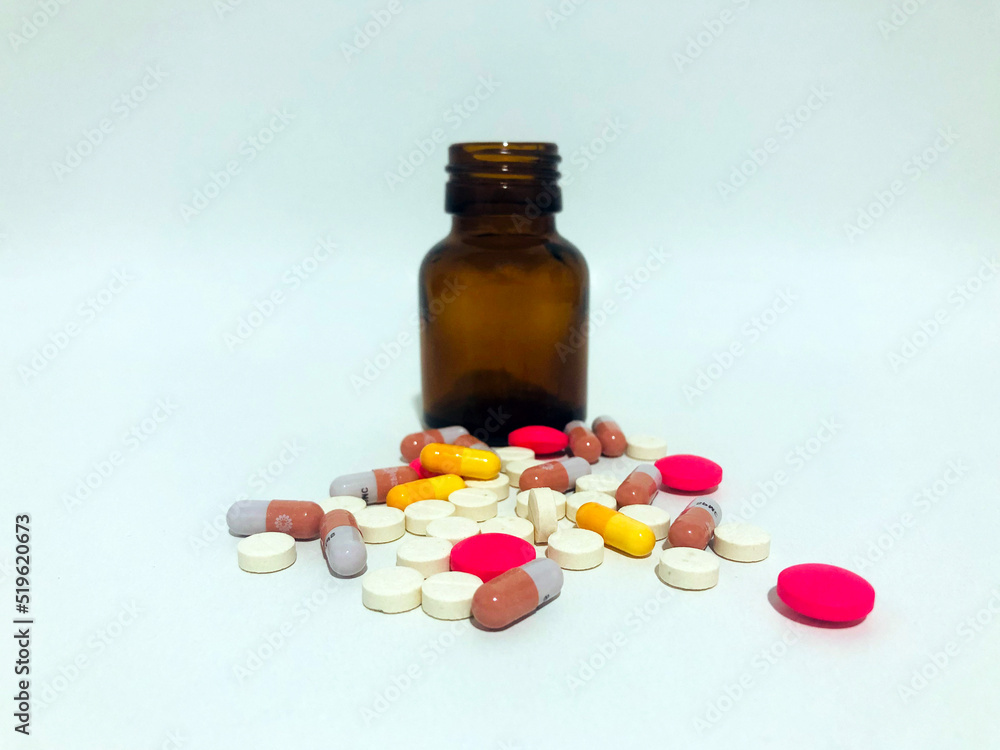 Medicine Pills or Tablets Drop and Out of the Brown Glass Bottle. Medicine Pills or Tablets Drop and Out of the Brown Glass Bottle.