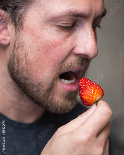 Eating fresh strawberries as a concept 