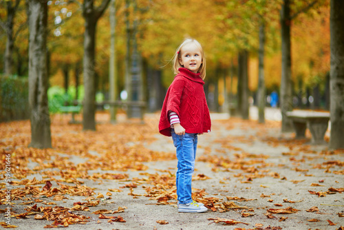 Adorable preschooler girl walking in Tuileries garden in Paris, on a fall day © Ekaterina Pokrovsky