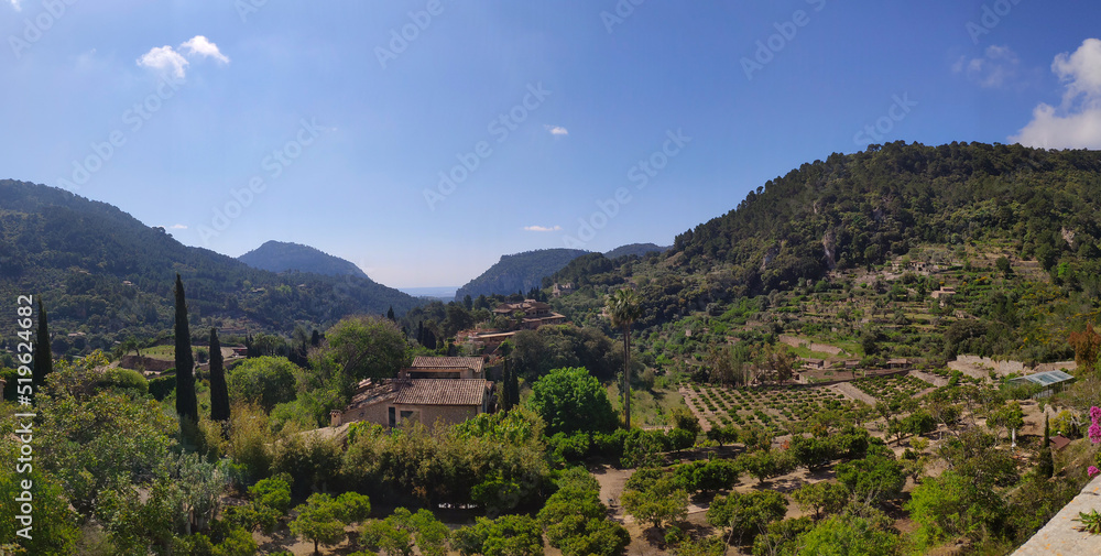 Panorama view of mountain and gardens in Valldemossa, Mallorca, Spain. Village in the valley surrounded by mountains.