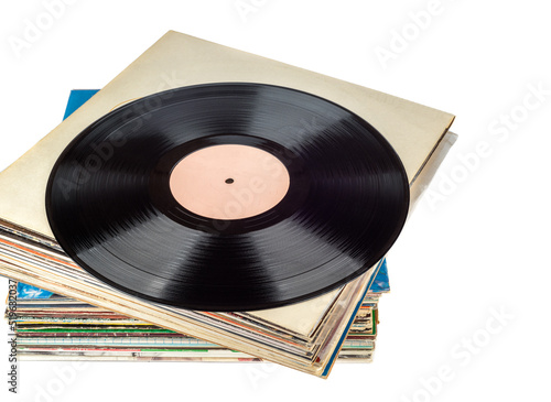Stack of records in a package and one disc on top of the stack.