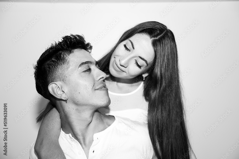 couple in love, young red-haired woman with long hair looking at young man, white teeth, features and gestures, vertical, black & white couple in love, young red-haired woman with long hair looking at young man, white teeth, features and gestures, vertical, black & white