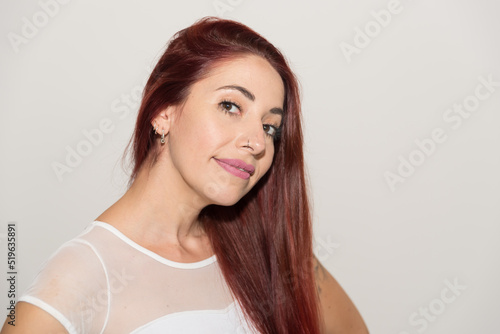 young latina woman, redhead and long hair 