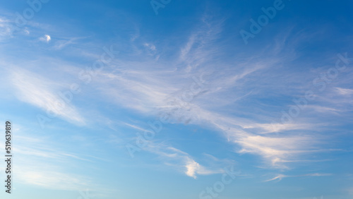 White fluffy clouds on blue clear sky © Linas T