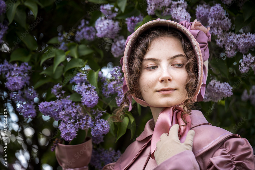 Obraz premium Young woman in historical dress. Fashionable clothes of the 19th century. Historical women's costume.