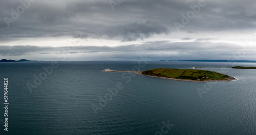 aerial view of the Clare Island lighthouse on one of the sunken drumlin islands in Clew Bay in County Mayo of western Ireland photo